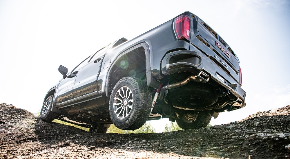 A black 2025 GMC Sierra 1500 from the rear at an angle.