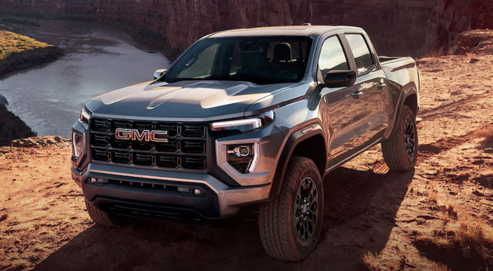 Silver 2026 GMC Canyon driving off road