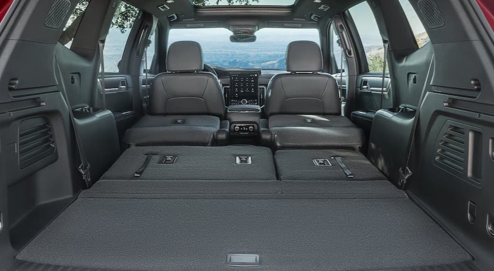 The gray interior of the rear cargo area in a 2026 GMC Acadia.