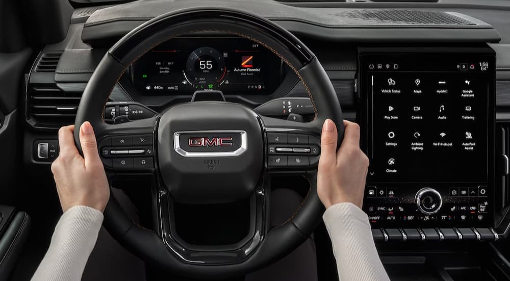 Close-up of the steering wheel in a 2026 GMC Acadia.