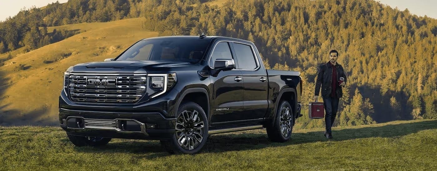 Black 2026 GMC Sierra 1500 Denali parked off-road