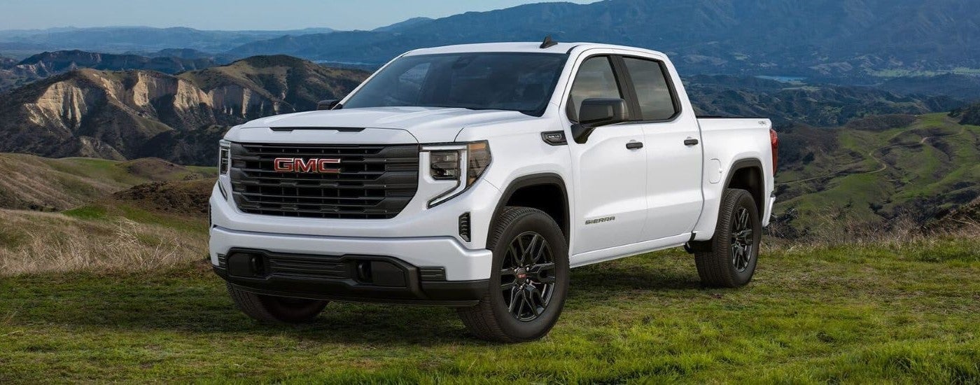 White 2024 GMC Sierra 1500 Graphite Edition parked off-road