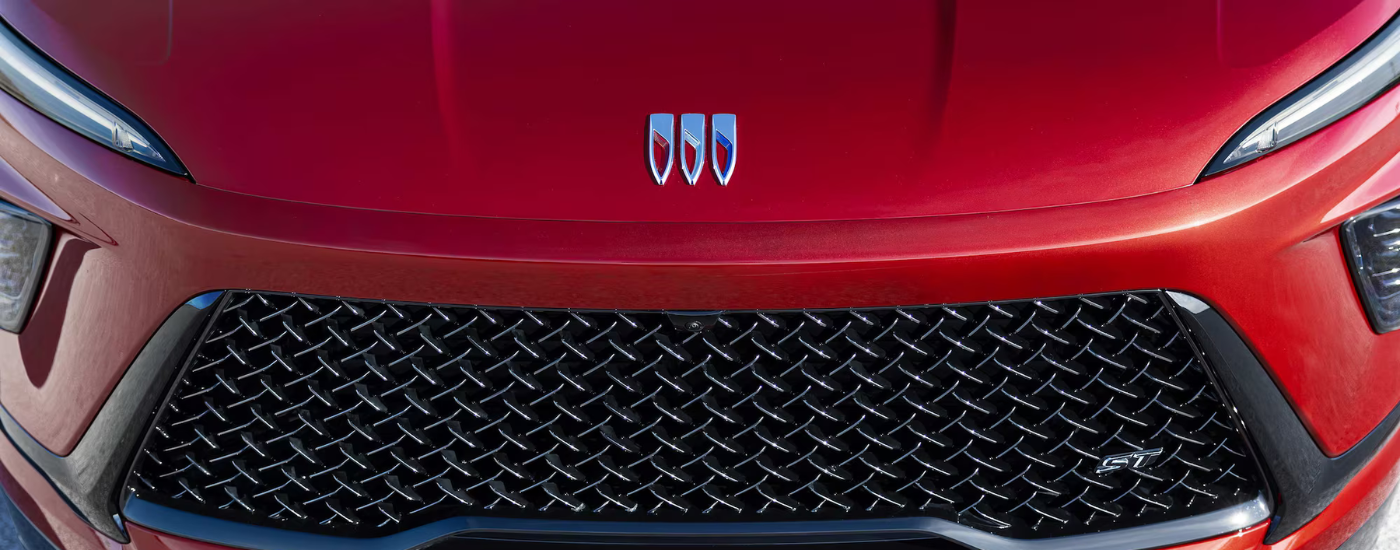 Hood badging on a red 2026 Buick Enclave