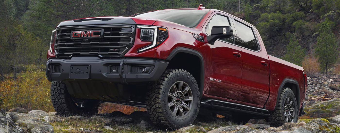 Red 2026 GMC Sierra 1500 parked on rocks