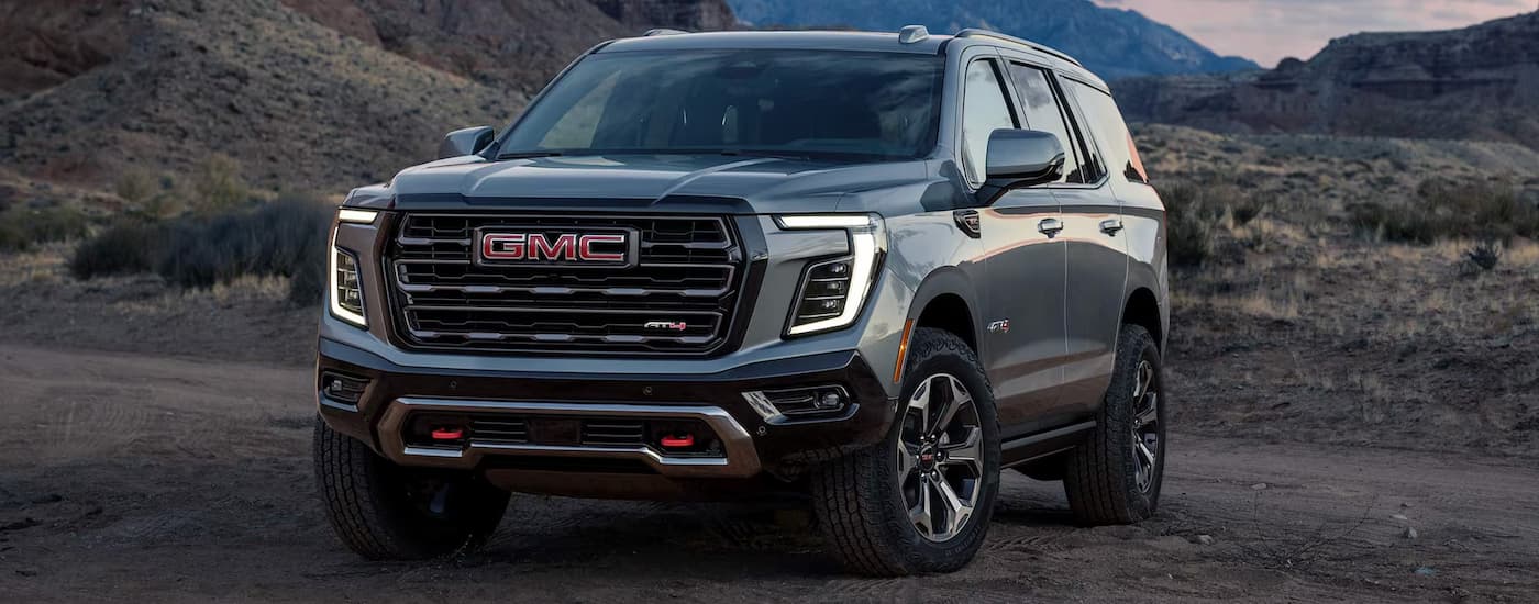 Grey 2026 GMC Yukon parked off-road.