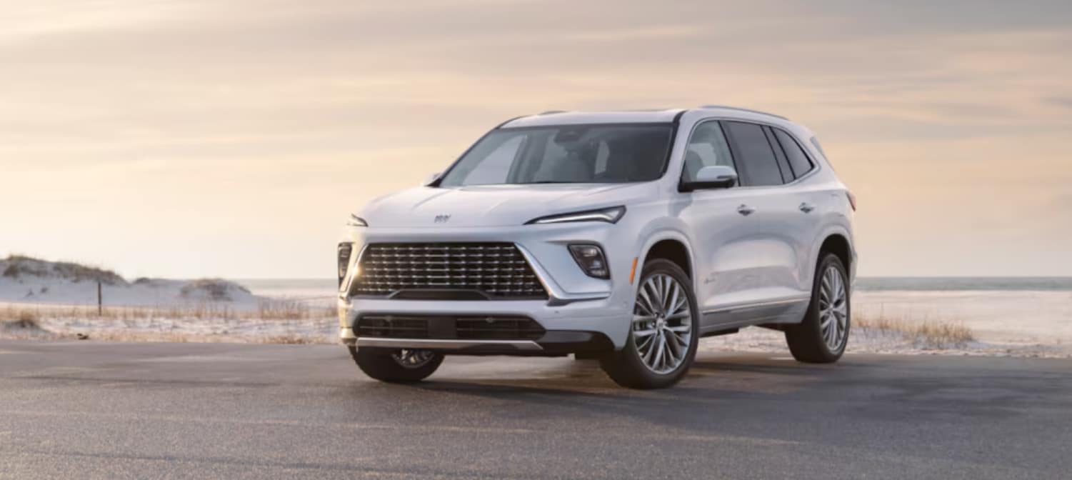A white 2025 Buick Enclave parked after visiting a Buick dealer near Minnetonka.
