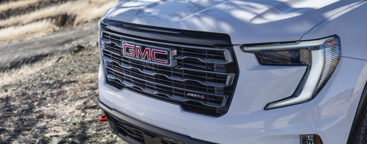 The grille on a white 2025 GMC Acadia AT4.