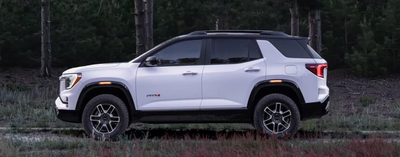 A white 2025 GMC Terrain AT4 parked after visiting a GMC dealer near Minnetonka.